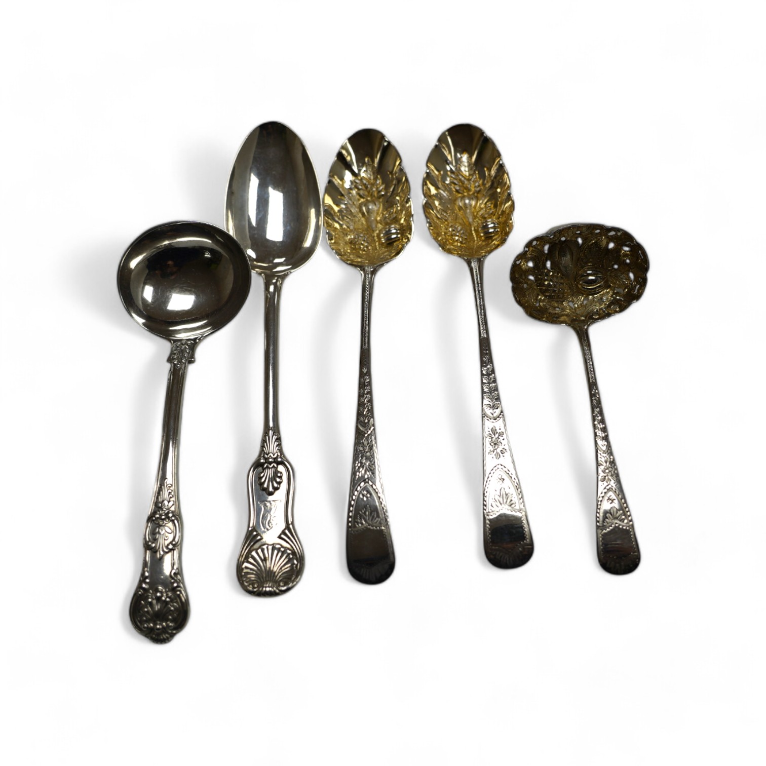 A pair of George III silver berry spoons, London, 1804, together with three other spoons, including a Georgian Scottish table spoon and a George III silver berry sifter spoon, Eley, Fearn & Chawner, London, 1809, 10.6oz.